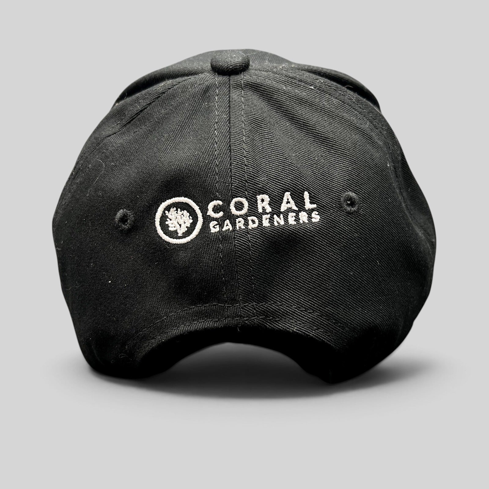 Raree Finds black Coral Gardeners strapback hat with white embroidered logo on the back panel