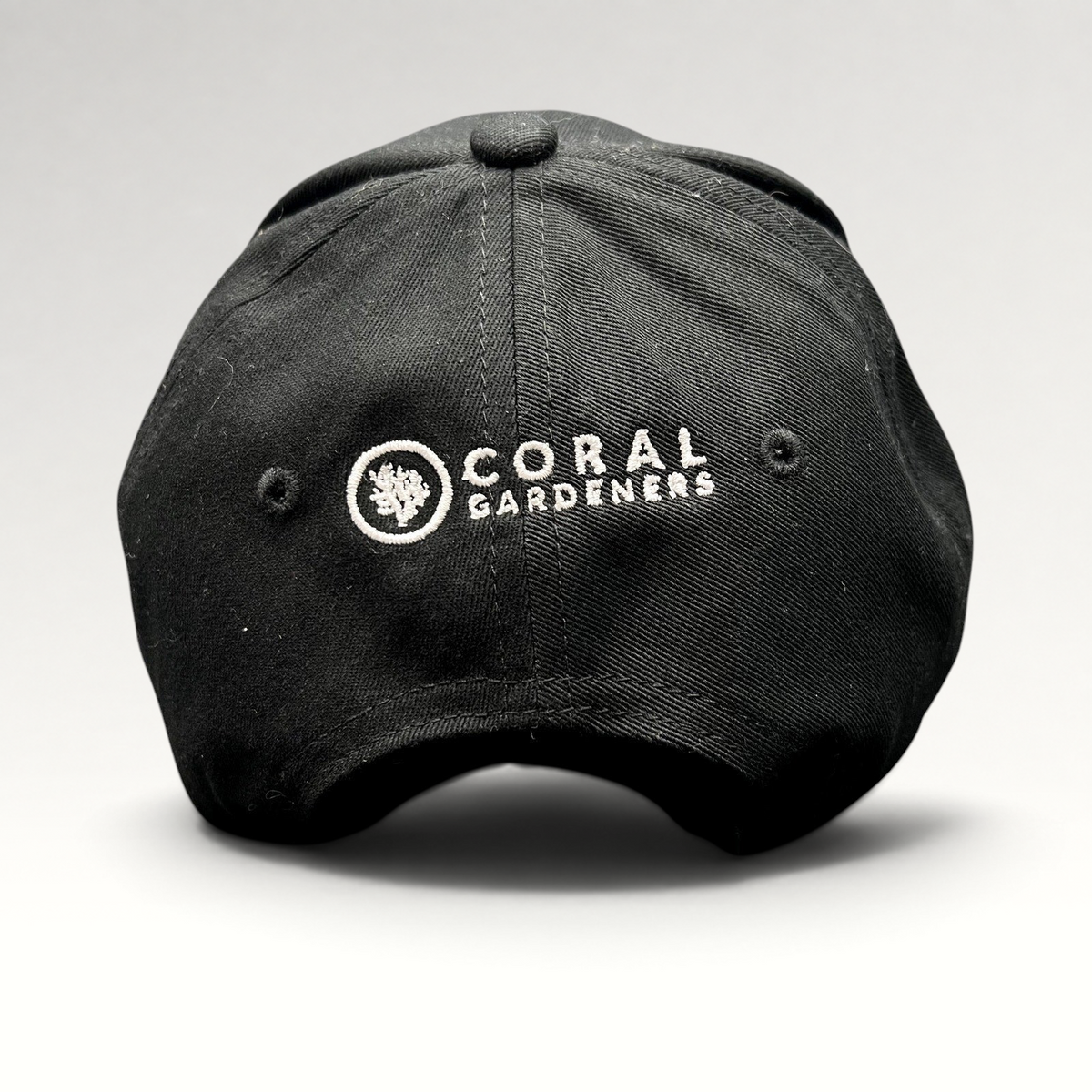 Raree Finds black Coral Gardeners strapback hat with white embroidered logo on the back panel