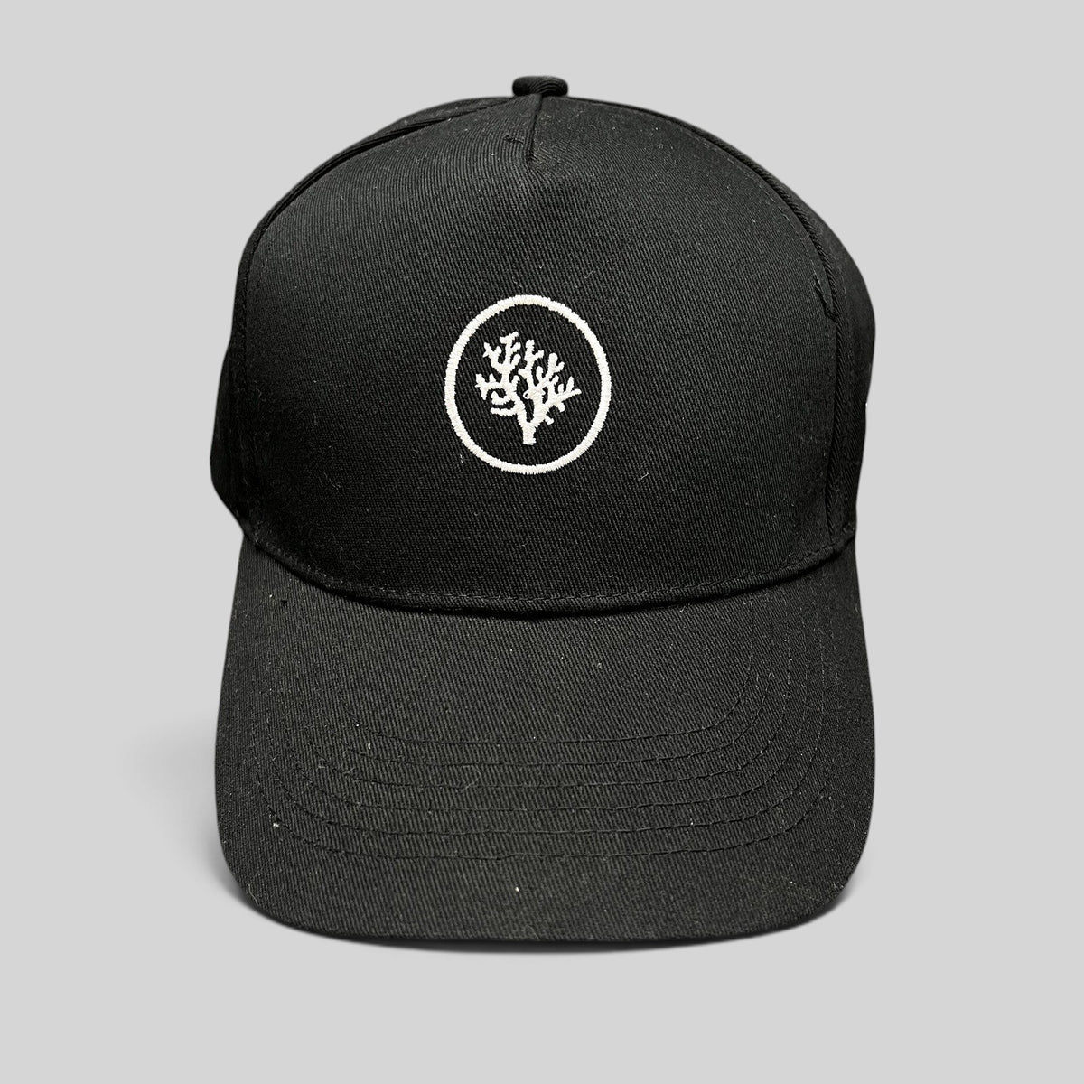 Raree Finds black Coral Gardeners strapback cap with white embroidered coral logo on the front