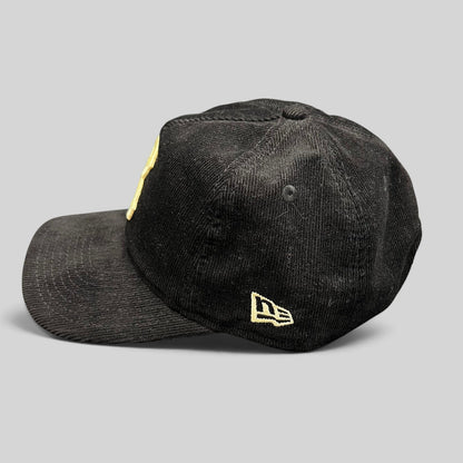 Raree Finds black corduroy New Era 9TWENTY Brooklyn Dodgers snapback hat with cream embroidery, side profile view.