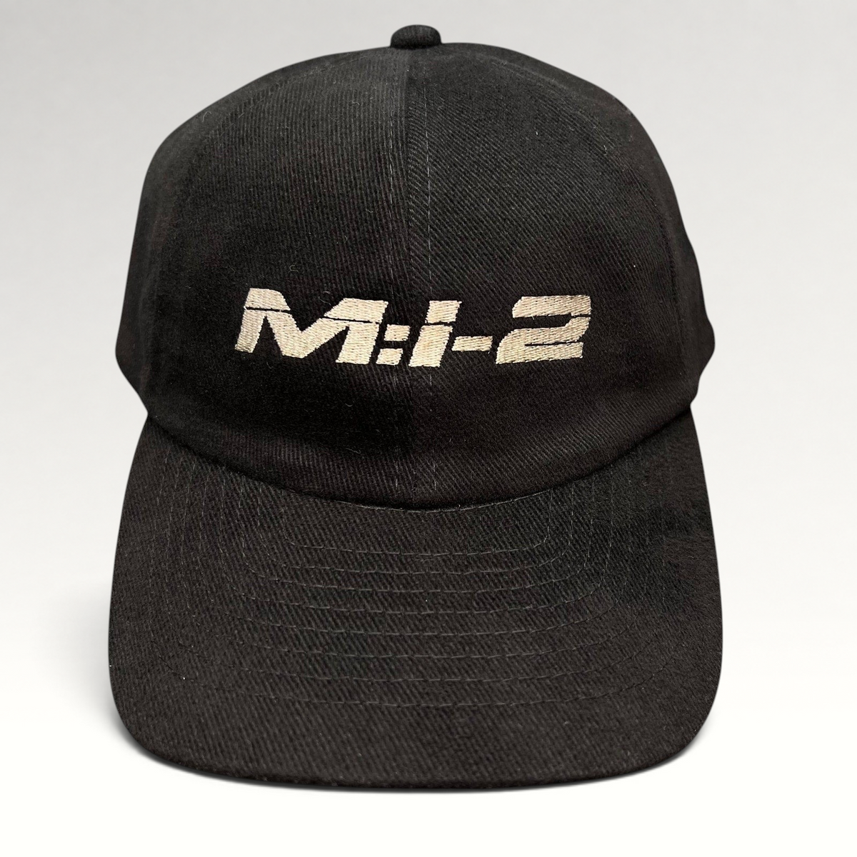 Raree Finds vintage black corduroy snapback hat featuring embroidered M:I-2 Mission Impossible 2 movie logo