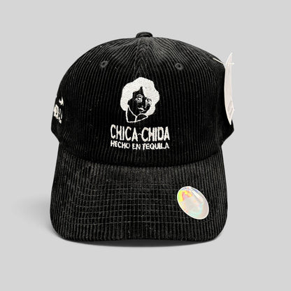 Raree Finds black corduroy strapback hat featuring white embroidered Chica~Chida logo and Hecho en Tequila text.