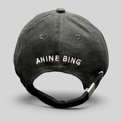 Raree Finds black cotton dad cap with white ANINE BING logo embroidery on the back and adjustable metal buckle strap