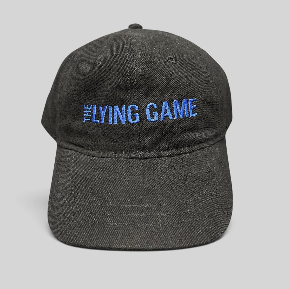 Raree Finds black cotton strapback hat with blue The Lying Game embroidery, 2010 TV pilot crew promotional cap.