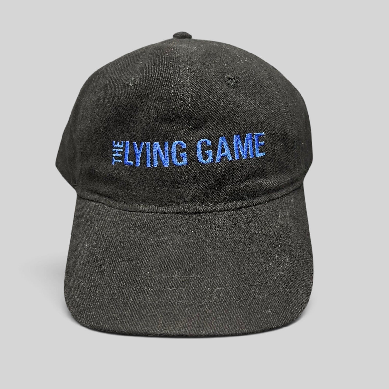 Raree Finds black cotton strapback hat with blue The Lying Game embroidery, 2010 TV pilot crew promotional cap.