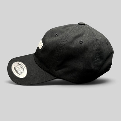 Raree Finds black cotton Yupoong Classics dad cap with white script logo embroidery and adjustable strapback closure