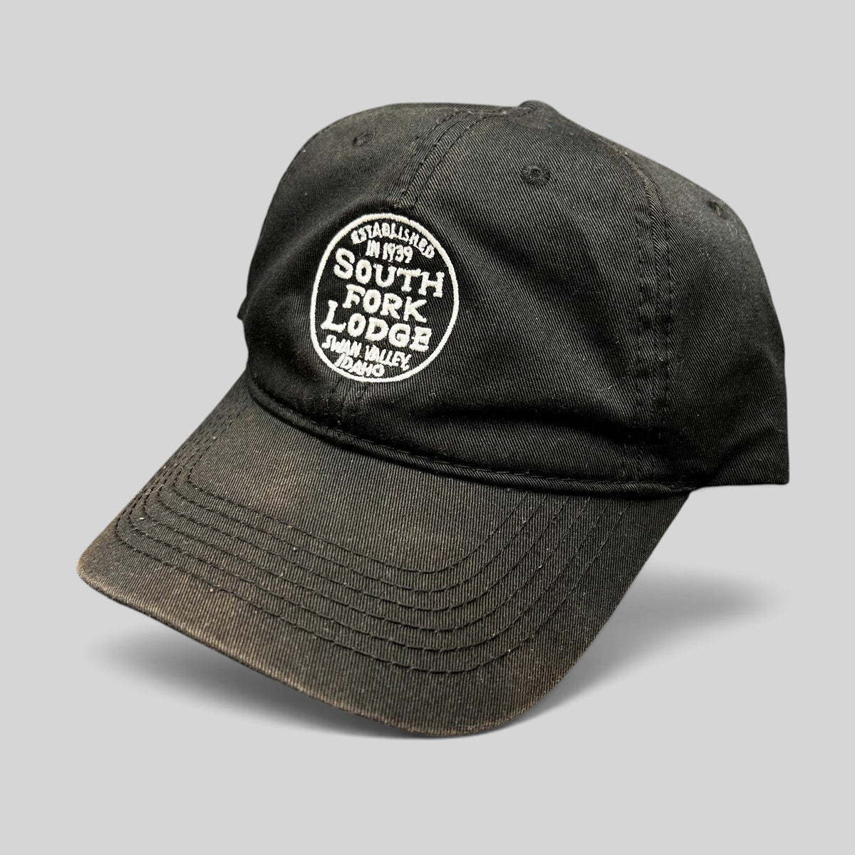 Raree Finds black cotton strapback hat with white embroidered South Fork Lodge Swan Valley Idaho fly fishing logo