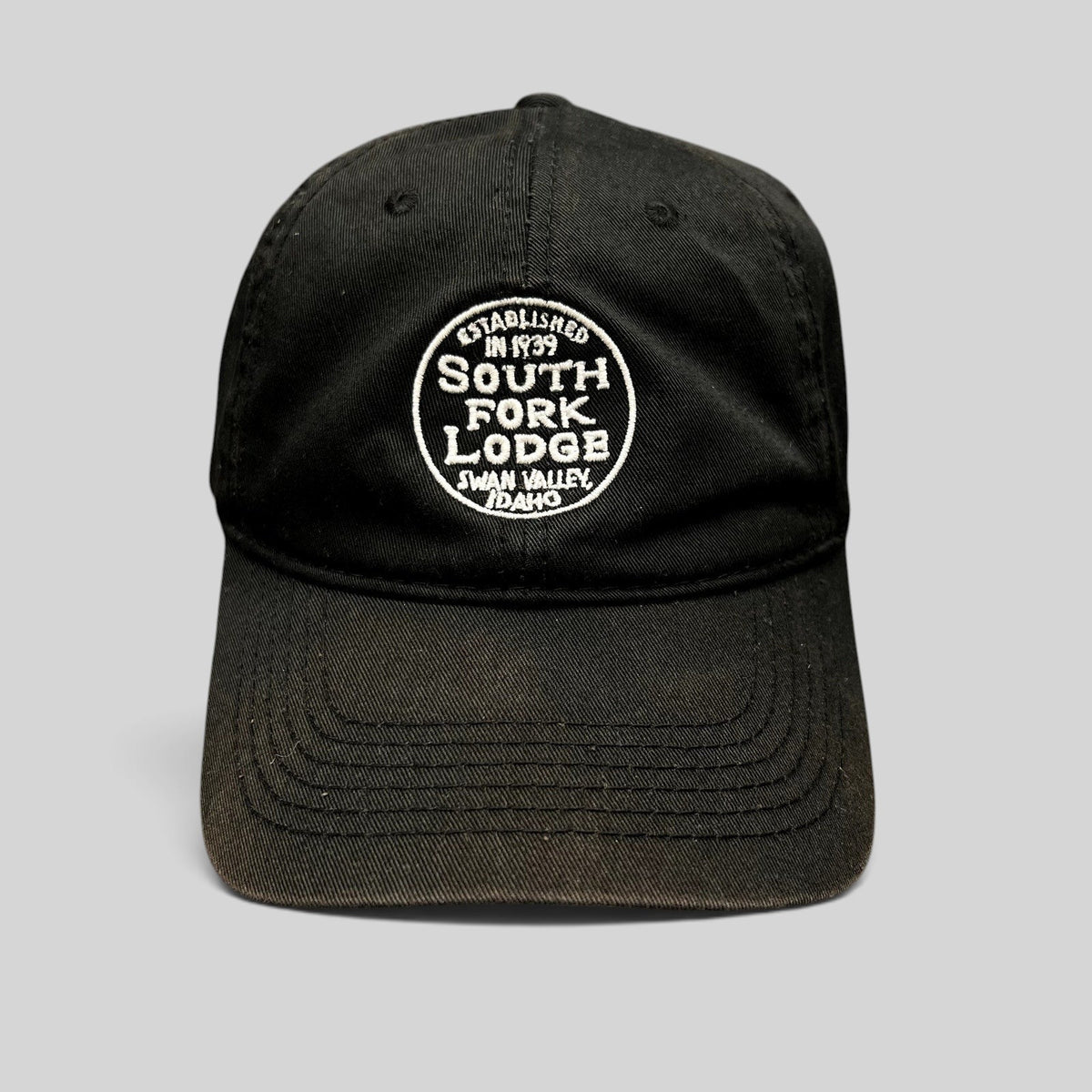 Raree Finds black cotton strapback hat with white embroidered South Fork Lodge Swan Valley Idaho logo