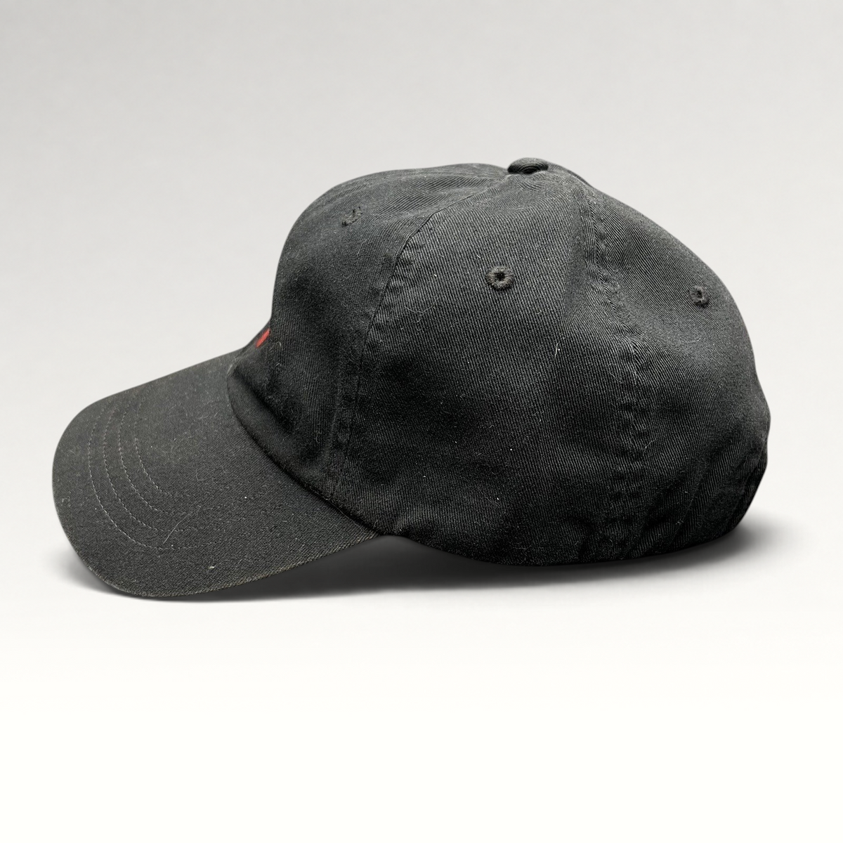 Raree Finds black cotton twill Polo Ralph Lauren strapback hat with red embroidered pony logo, side profile view.