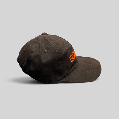 Raree Finds black cotton strapback hat with orange Mahanakhon Skate Club embroidery on an unstructured crown