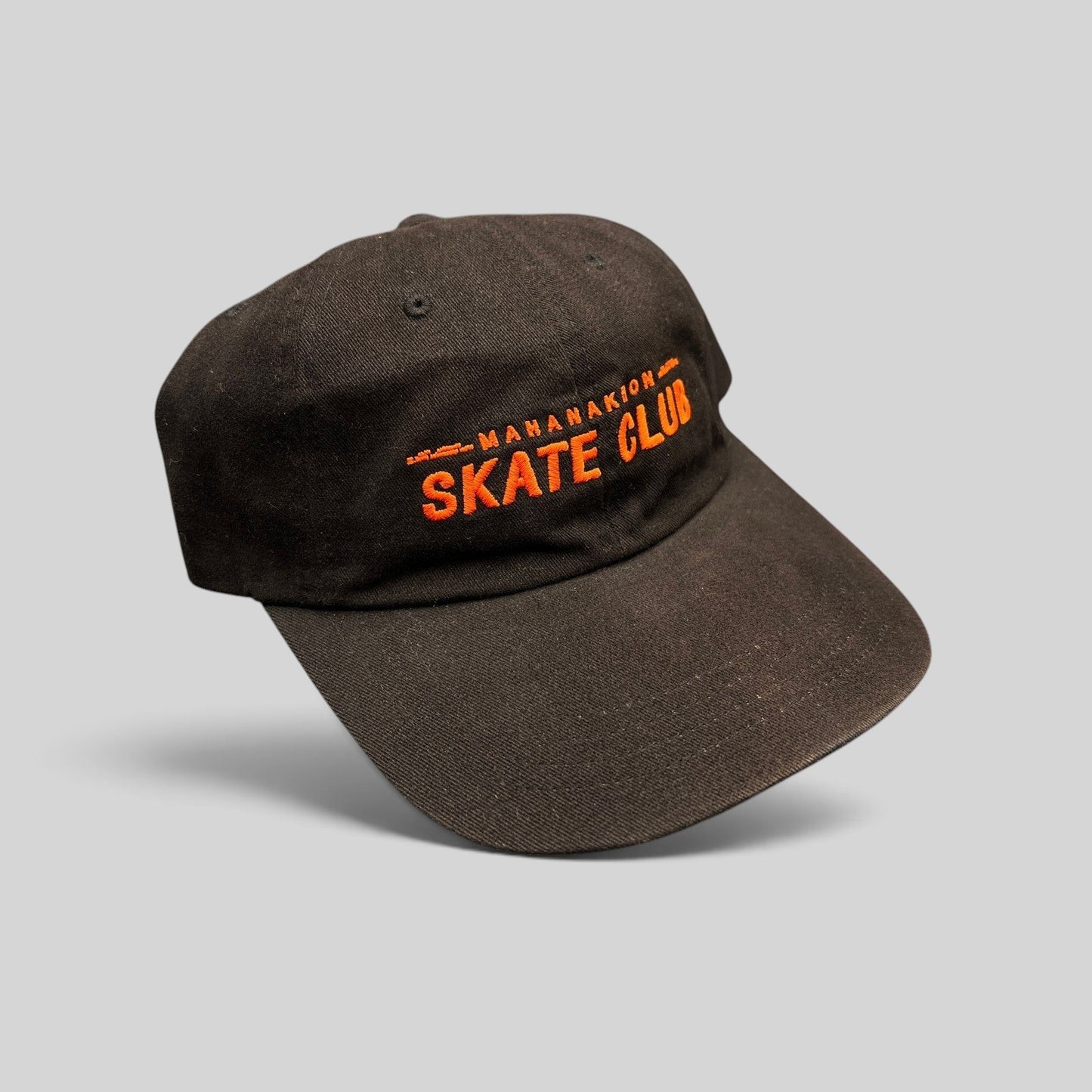 Raree Finds black cotton strapback hat with orange Mahanakhon Skate Club embroidery on an unstructured crown