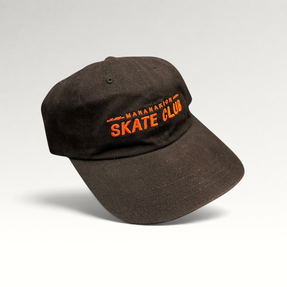 Raree Finds black cotton strapback hat with orange Mahanakhon Skate Club embroidery on an unstructured crown