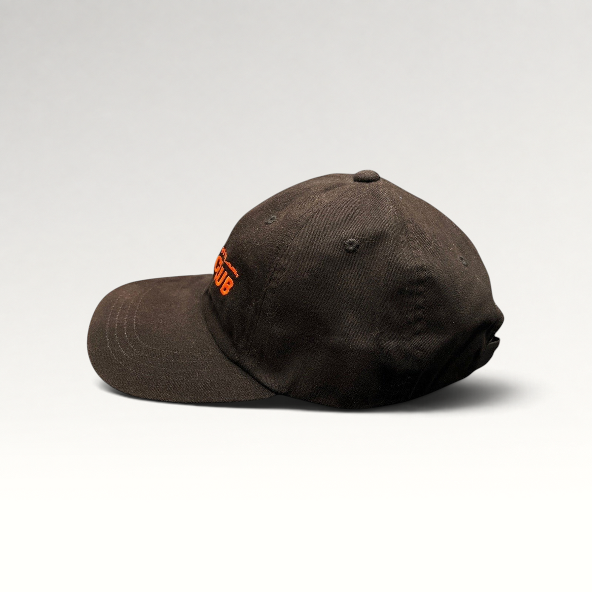 Raree Finds black cotton strapback hat with orange Mahanakhon Skate Club embroidery, side profile view.