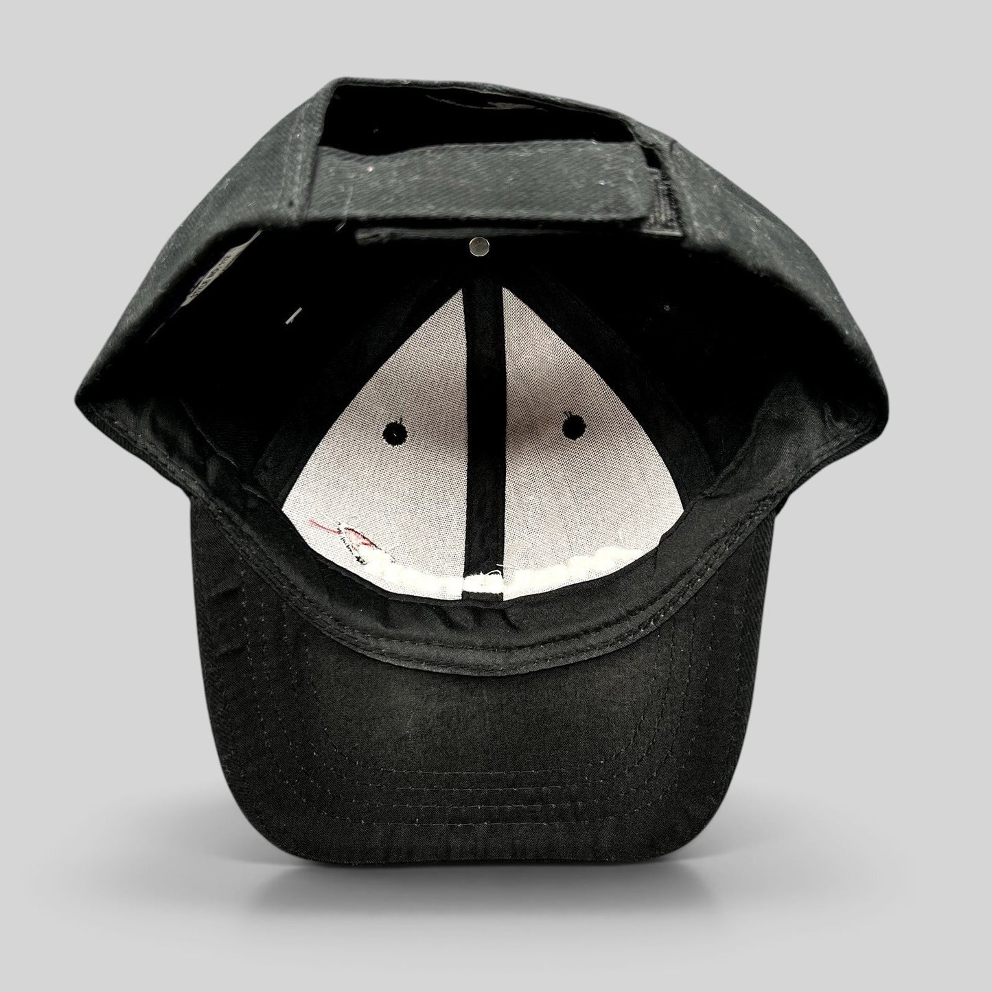 Raree Finds black cotton strapback cap interior view showing the six-panel construction and adjustable velcro strap