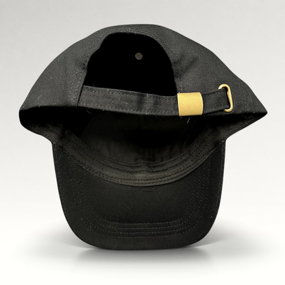 Raree Finds black cotton strapback hat with gold metal buckle closure, rear view showing adjustable strap