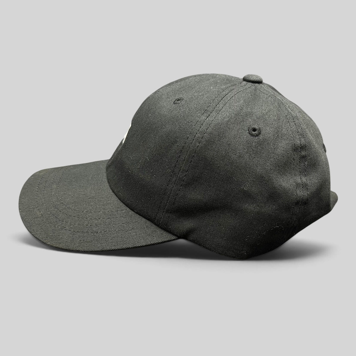 Raree Finds black cotton Anti Social Social Club strapback dad hat with Japanese flag graphic, side profile view.