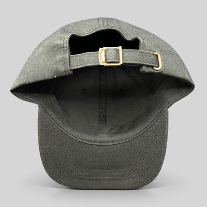 Raree Finds black cotton strapback hat with adjustable metal buckle closure, showing the back view.