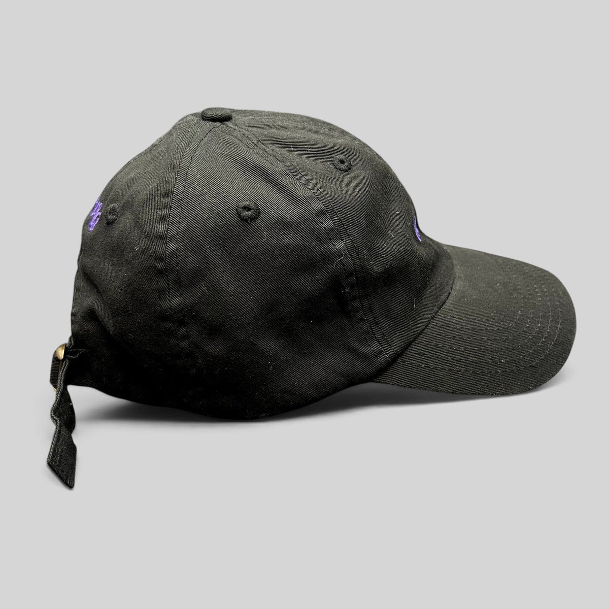 Raree Finds black cotton twill dad hat with purple embroidered No Notes text and adjustable brass buckle strapback