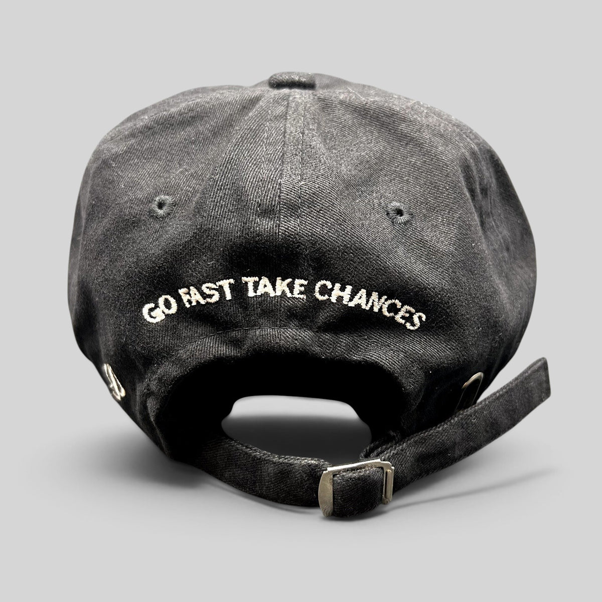 Raree Finds black cotton strapback hat with Go Fast Take Chances embroidered on the back and metal slide buckle