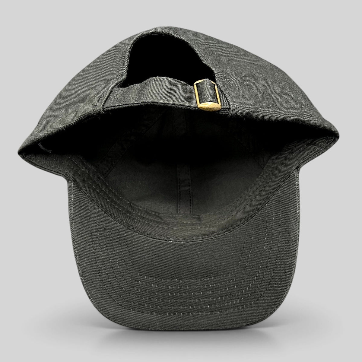 Raree Finds black cotton strapback hat from the John Wick Ballerina stunt department with adjustable brass buckle