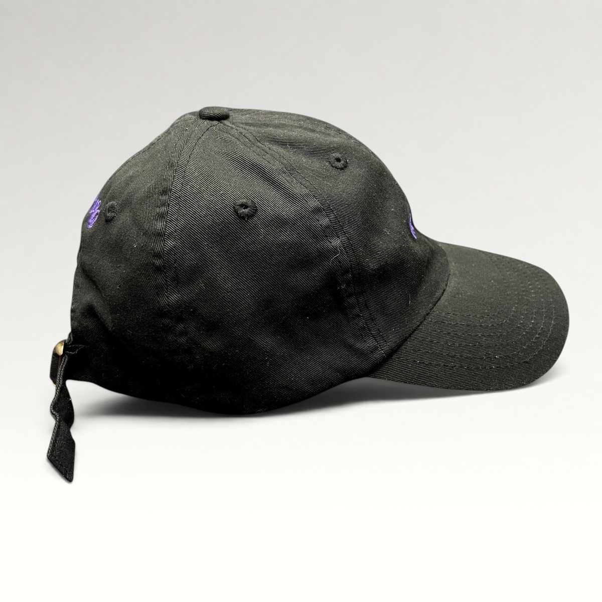 Raree Finds black cotton twill dad hat with purple embroidered No Notes text and adjustable brass buckle strapback