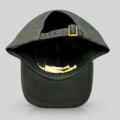Raree Finds black cotton strapback hat with gold buckle detail, showing the adjustable back strap and interior