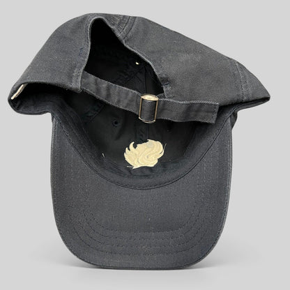 Raree Finds black cotton strapback hat from The Phoenician Scottsdale showing the adjustable metal buckle closure