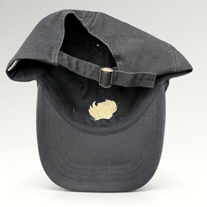 Raree Finds black cotton strapback hat from The Phoenician Scottsdale showing the adjustable metal buckle closure