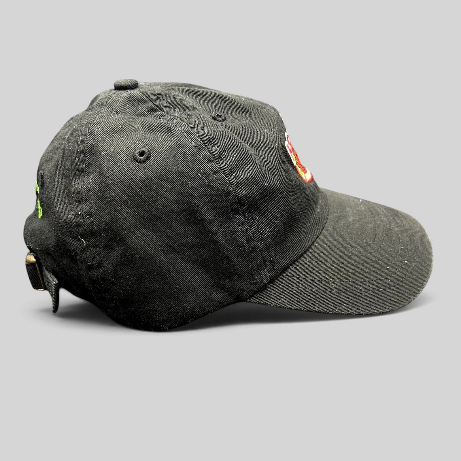 Raree Finds black cotton strapback hat with Kelly’s Restaurant crab logo embroidery and side profile view