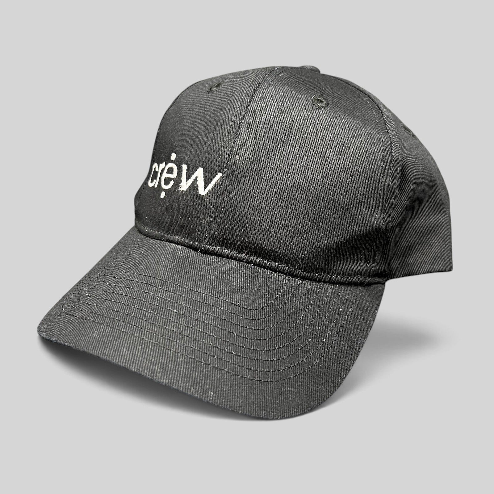 Raree Finds black KC Headwear snapback hat with white embroidered crew logo on a structured six-panel crown