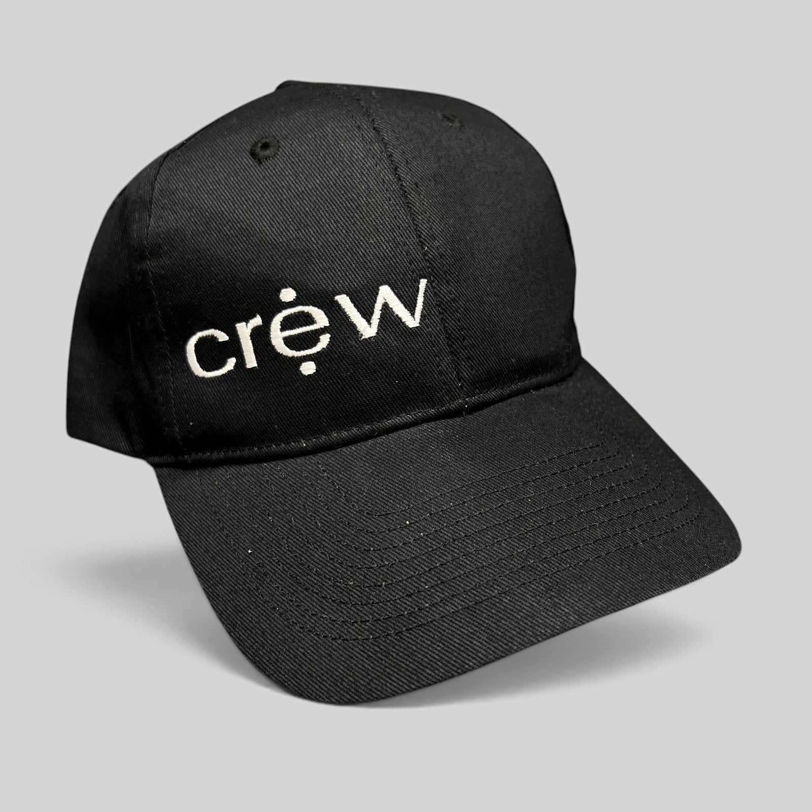 Raree Finds black KC Headwear snapback hat with white embroidered crew logo on a structured six-panel crown