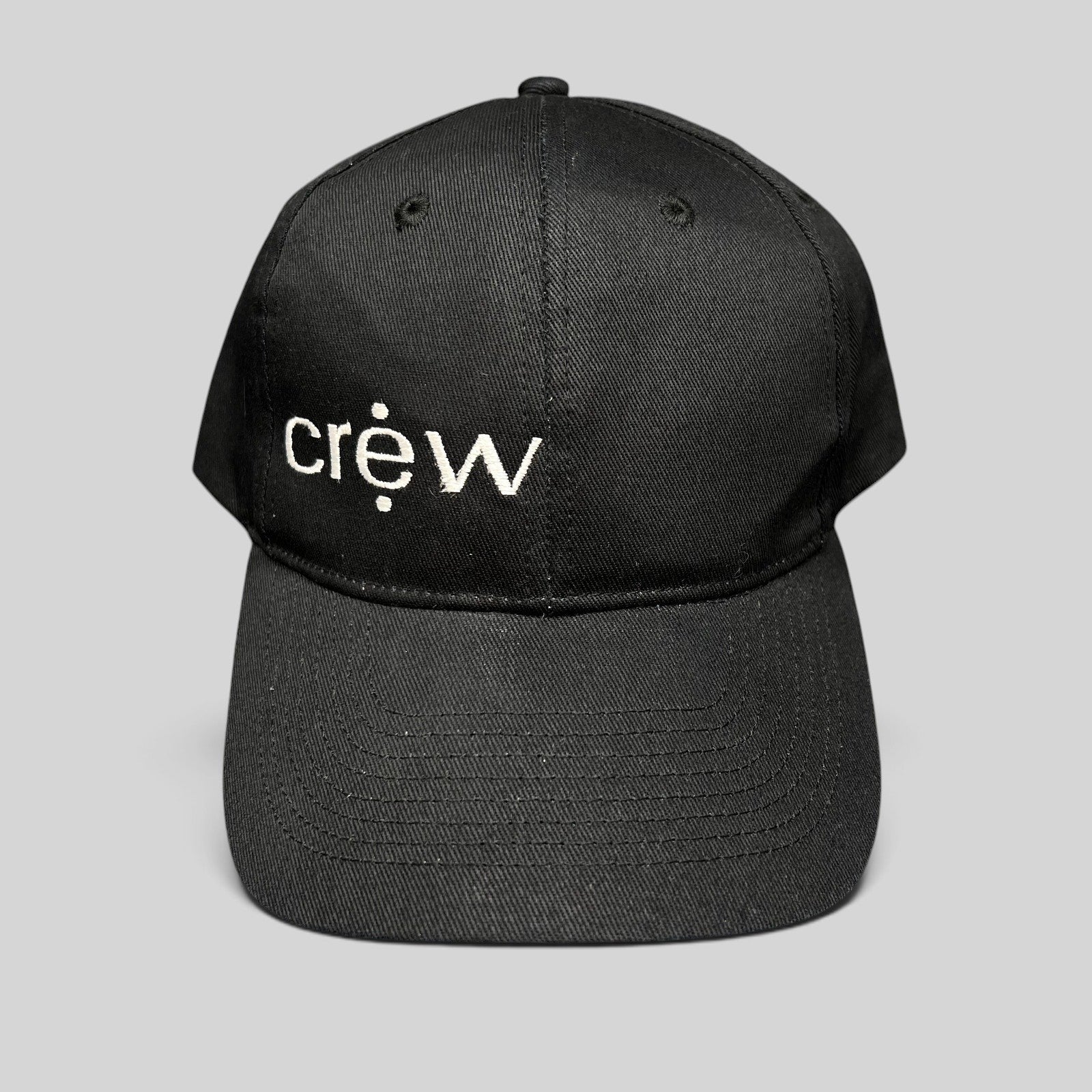 Raree Finds black KC Headwear snapback hat with white embroidered crew logo on a structured six-panel crown