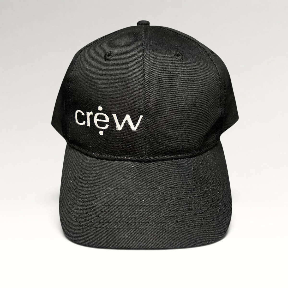 Raree Finds black KC Headwear snapback hat with white embroidered crew logo on a structured six-panel crown