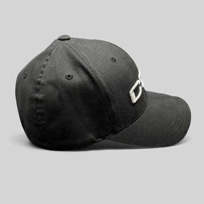 Raree Finds black Yupoong Flexfit cap with raised white CSI embroidery, side profile view.