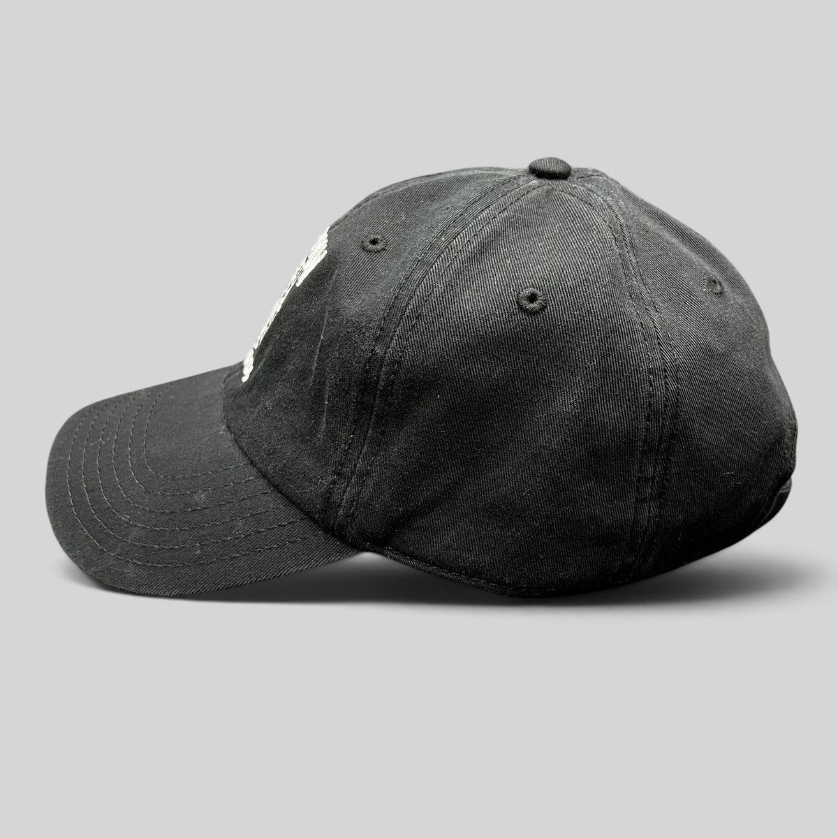 Raree Finds black cotton strapback hat with white Death Row Records logo embroidery and curved brim side view