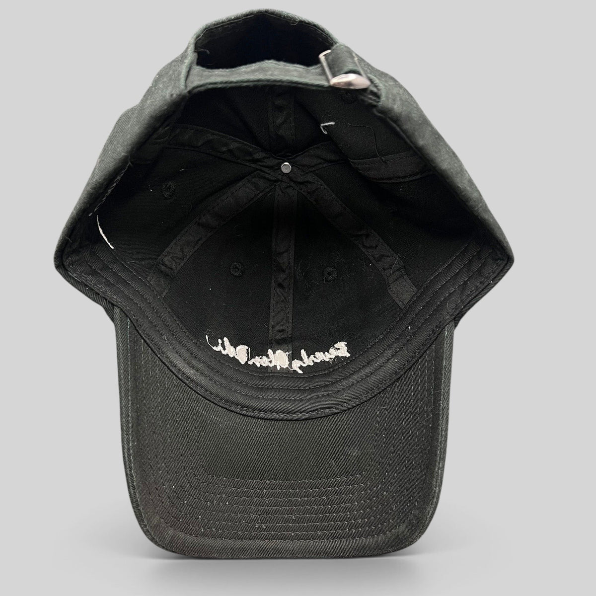 Raree Finds black cotton strapback hat by Farewell Headwear with white Beverly Glen Deli script embroidery