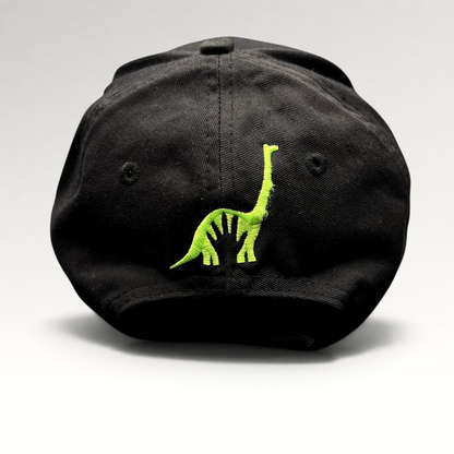 Raree Finds black strapback hat featuring green embroidered dinosaur character on the back from The Good Dinosaur movie