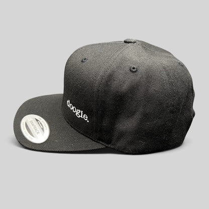 Raree Finds black Yupoong The Classics snapback hat featuring white embroidered doogie logo on the side profile.