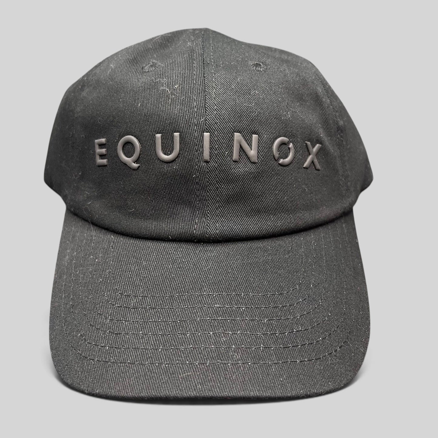 Raree Finds black Equinox fitness snapback hat with raised rubberized logo lettering on the front