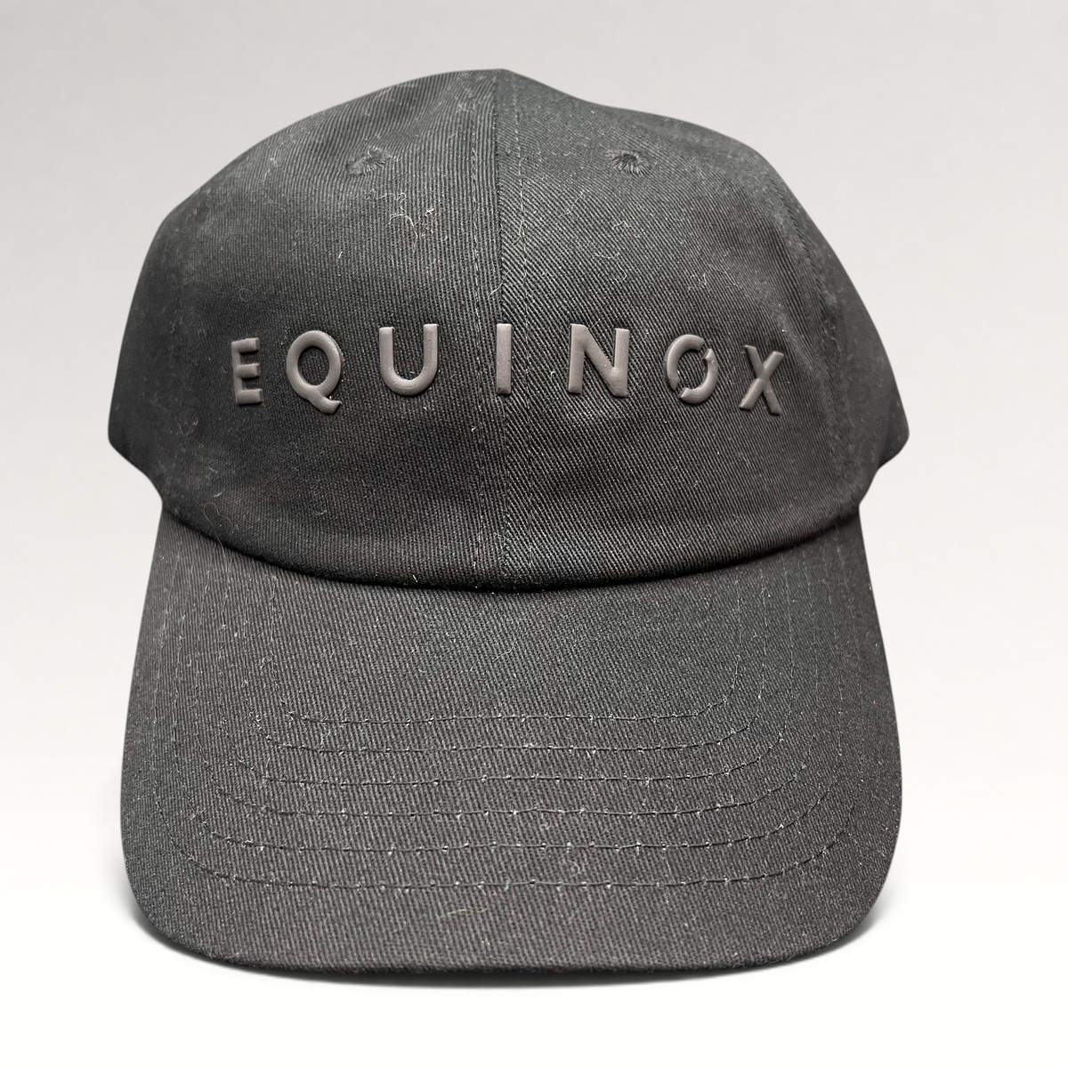 Raree Finds black Equinox fitness snapback hat with raised rubberized logo lettering on the front