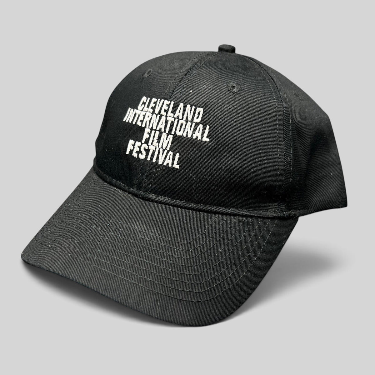 Raree Finds black strapback hat with white embroidered Cleveland International Film Festival lettering on the crown