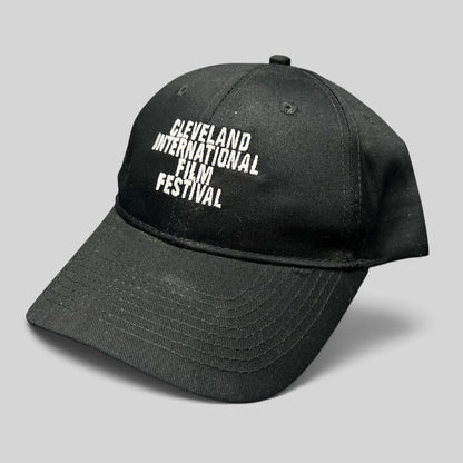 Raree Finds black strapback hat with white embroidered Cleveland International Film Festival lettering on the crown