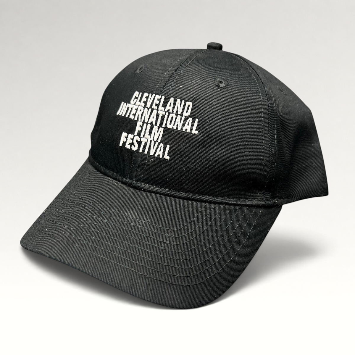 Raree Finds black strapback hat with white embroidered Cleveland International Film Festival lettering on the crown