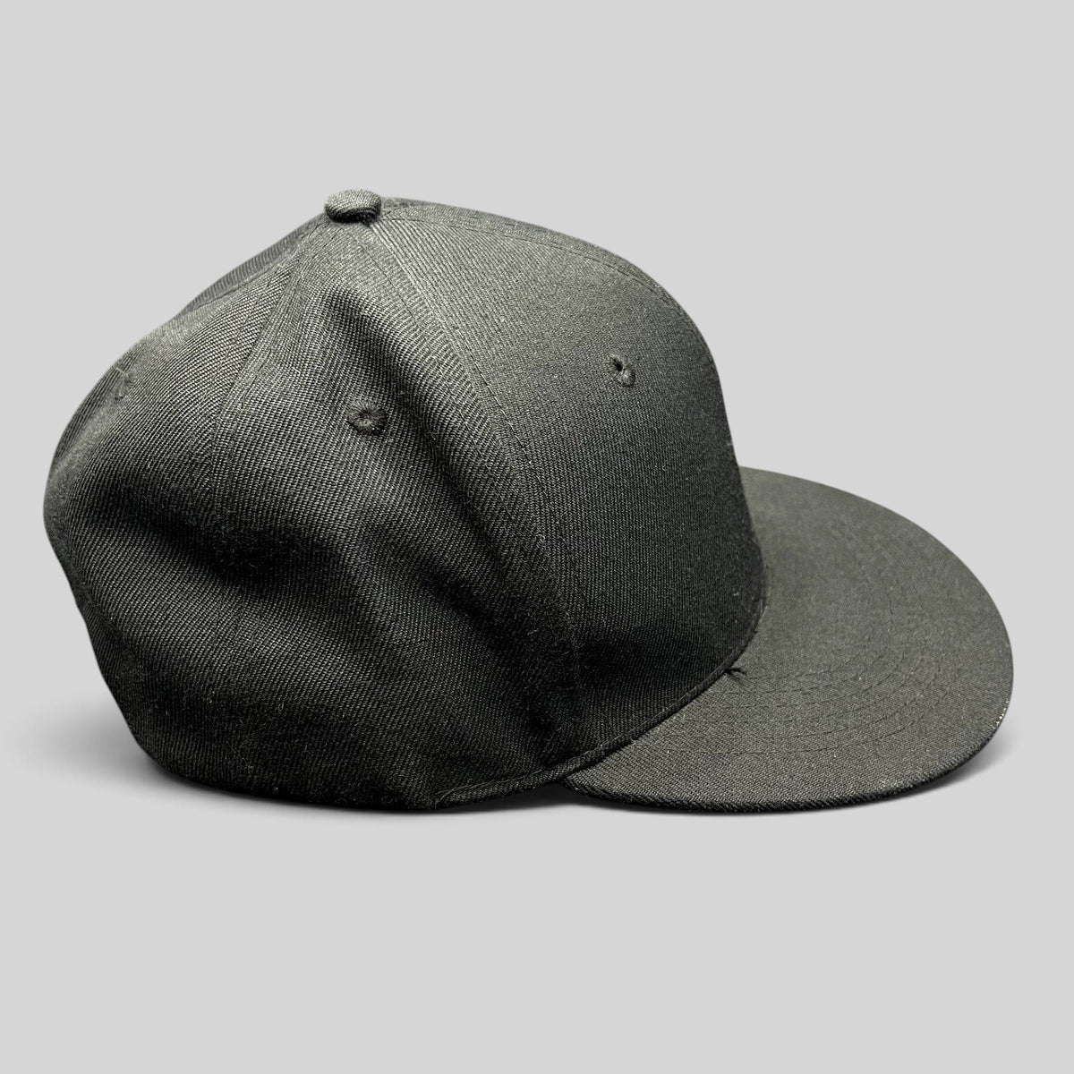 Raree Finds black Fits snapback hat with flat brim and structured crown, side profile view.