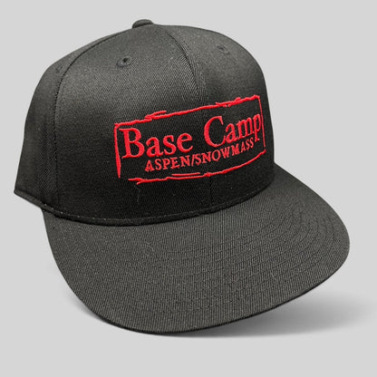 Raree Finds black Flexfit 210 fitted cap with red embroidered Base Camp Aspen Snowmass logo on the front crown.