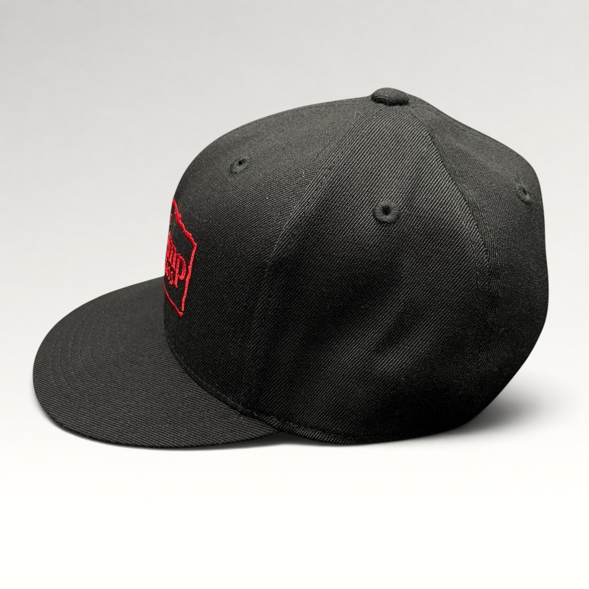 Raree Finds black Flexfit 210 fitted hat with red Base Camp Aspen Snowmass embroidered logo on the front