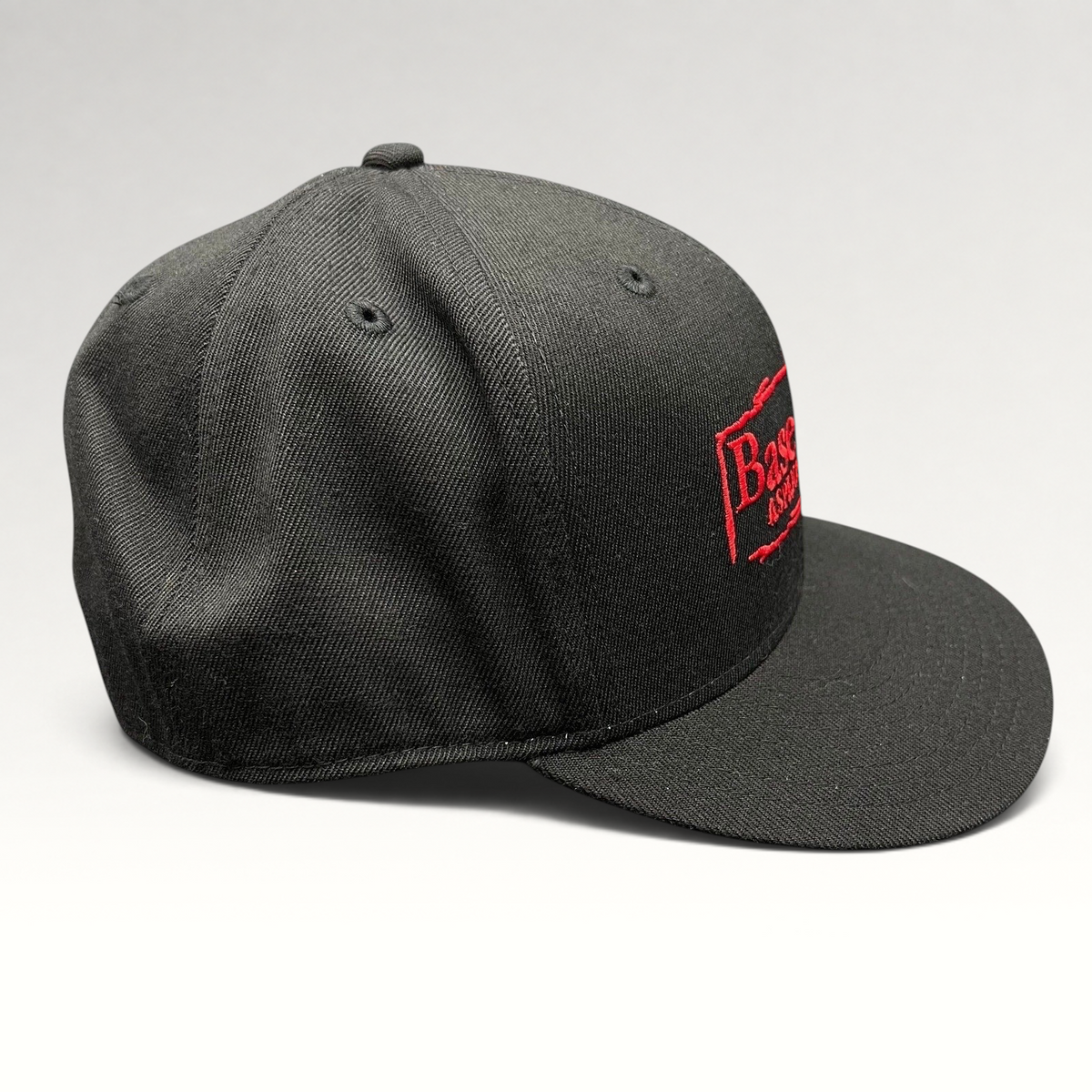 Raree Finds black Flexfit 210 fitted cap with red embroidered Base Camp Aspen Snowmass logo on the front
