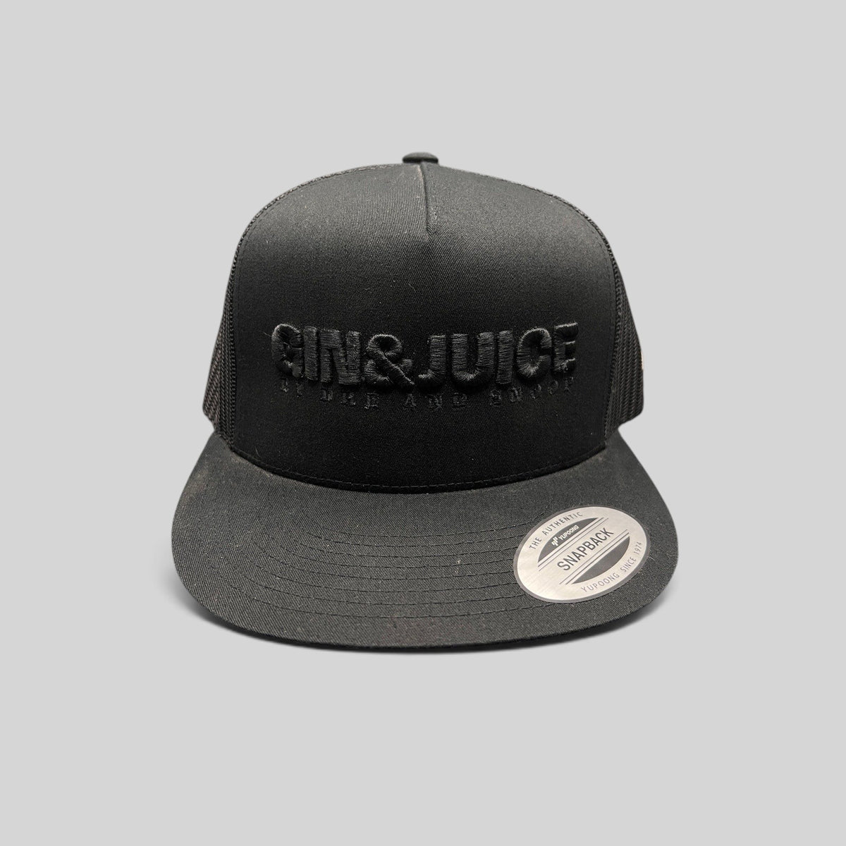 Raree Finds black Gin & Juice snapback hat with puff embroidery, flat bill, and mesh back on a dark background.