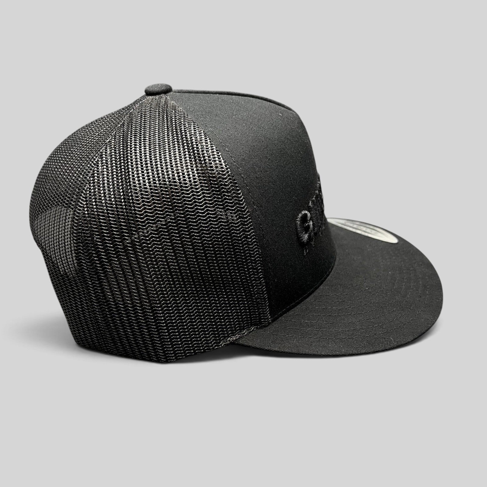 Raree Finds Gin & Juice black trucker snapback hat with tonal embroidery and breathable mesh back panels.
