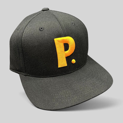 Raree Finds black Yupoong 110 Flexfit snapback hat featuring a bold gold embroidered P logo on the structured crown